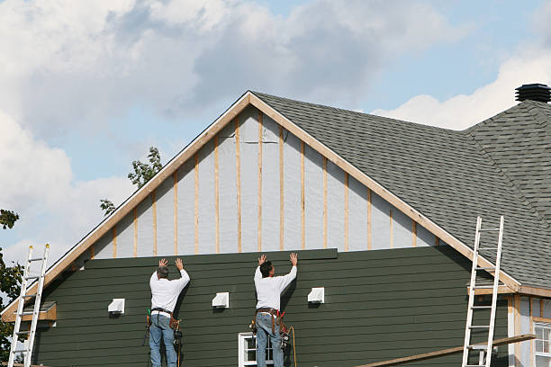 Professional Siding technician working in Plano, IL